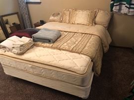 Like new Queen mattress/boxspring/frame. 4 comforter sets