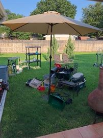 Brand new patio umbrella in iron stand