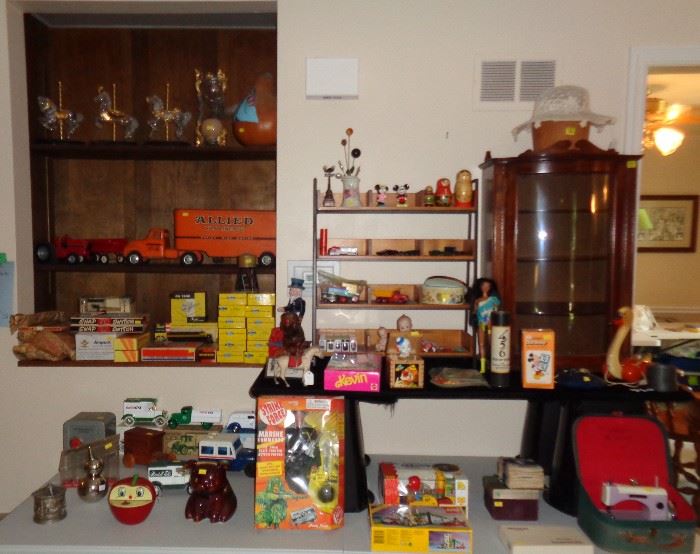 Vintage toys including a Tonka Allied Truck, Athearn ho trains in boxes, vintage table top curio cabinet