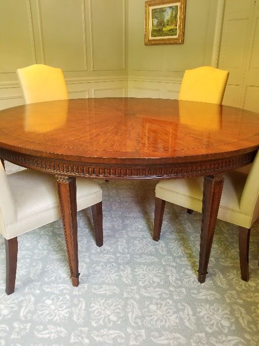 Beautiful round dining table. Can be expanded to oval with one leaf.