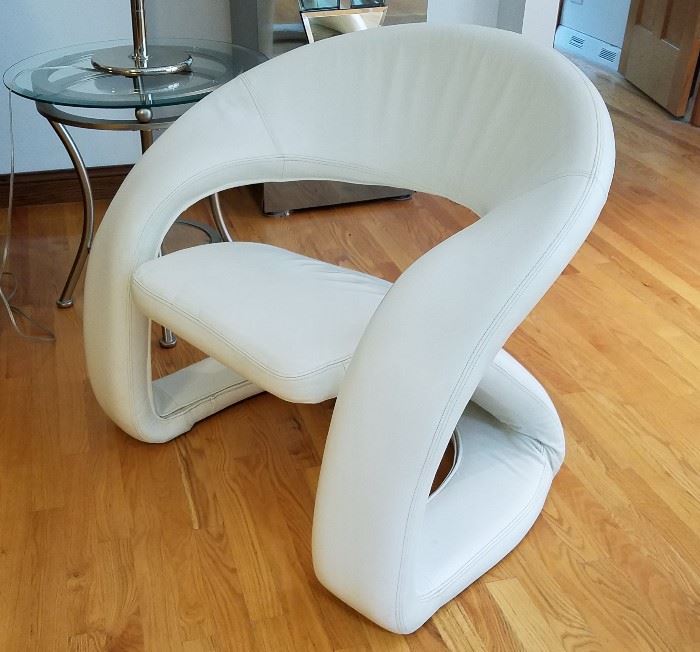 Modern white leather arm chairs.  Extremely comfortable.