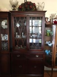 Small, beautiful 1950s china cabinet. Available