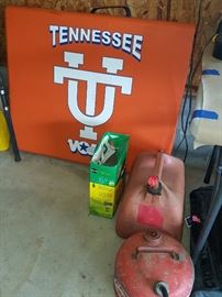 University of Tennessee Folding table shown with gas cans and Miracle Grow