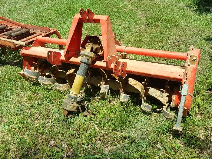 Tractor Tiller by First Choice.  Three Point Hitch rear tine rotary tiller.  5.5 feet wide
