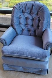 Blue upholstered swivel chair