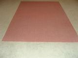 Coral colored area rug.