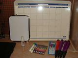 Dry erase board with markers.