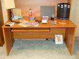 Laminate desk with several storage compartments.