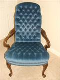 Blue velvet upholstered arm chair.