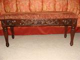 Upholstered wood settee.