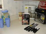 Knivesm, coffee pot and other kitchen ware.