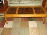 Glass top coffee table with matching end table.