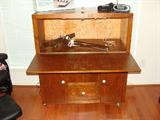 Wood rolling desk/storage cabinet.