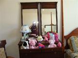 Antique wood dresser with double mirrors.