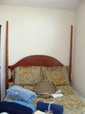 Antique wood Lexington bed frame with mattress.