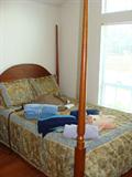 Antique wood Lexington bed frame with mattress.
