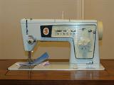 Sewing cabinet with Singer Special Zigzag sewing machine (Model 478)
