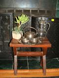 Small table with brass tea set.