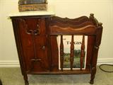 Marble top magazine rack with cigar box.