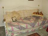 White metal trundle bed.