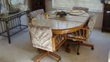 • Ashley Furniture dining table with 4 rolling upholstered chairs