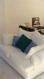 White upholstered love seat