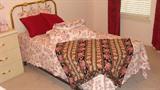 • Twin beds with metal headboard, box spring and mattress