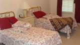 • Twin beds with metal headboard, box spring and mattress