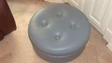 Round leather rolling ottoman
