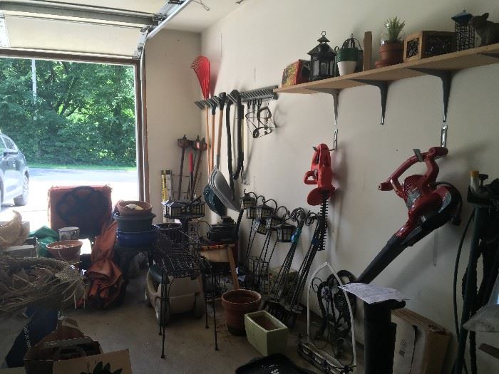 Hedge trimmer, blower/vacuum combo, many pots, solar garden lights, garden tools and statuary