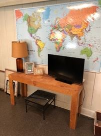 Large plastic coated wall map, pine table