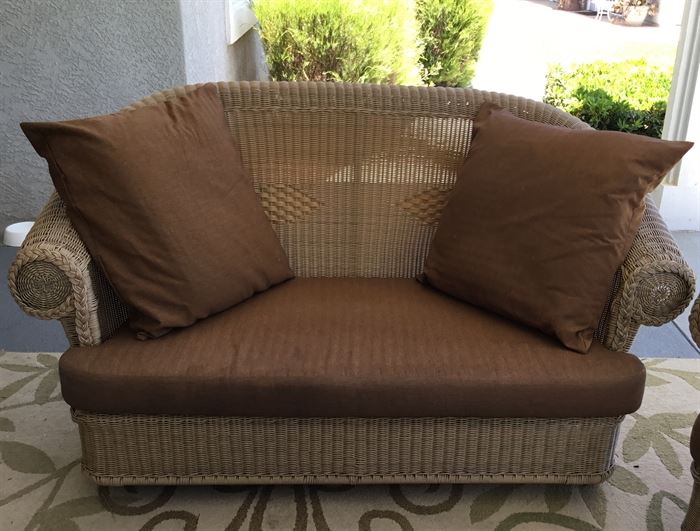 Outdoor wicker love seat in good condition.