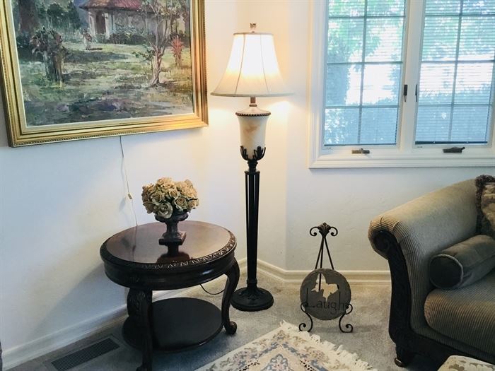Medium sized round table and large floor lamp