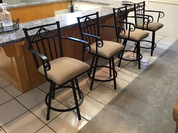 Four iron barstools. These are heavy and well made. They do swivel.