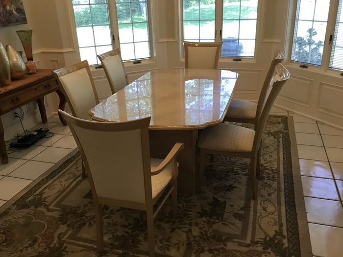 Marble look formal dining room table with 8 upholstered chairs