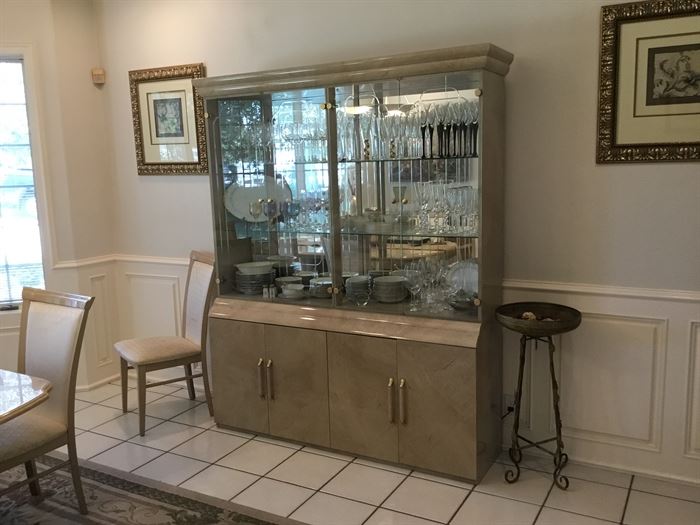 Beautiful neutral china cabinet with glass shelves.  This piece matches the dining room table