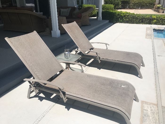 Two lounge chairs. One is damaged.