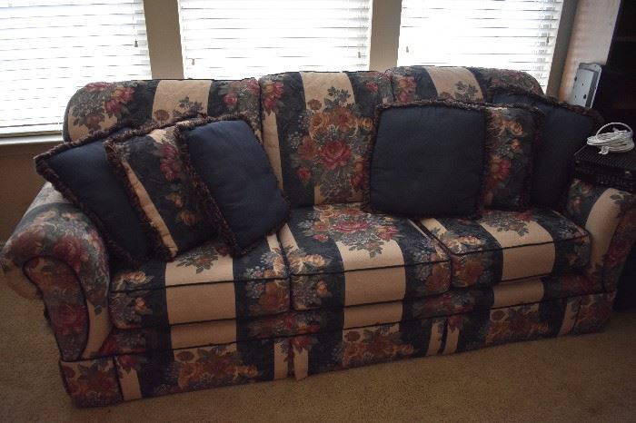 Floral couch with matching pillows.