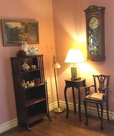 Pretty Victorian display cabinet or bookcase, brass Asian style lamp, tall child's chair - it's not "old" but it's really unique & pretty! This home also has a huge tea pot & tea cup collection. 