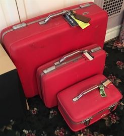 Set of red vintage luggage