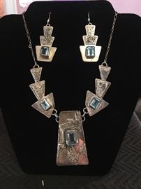 Unique sterling necklace with blue topaz stones. Marked JH on the back 