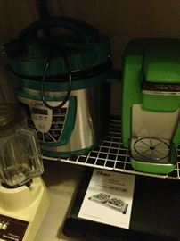Small appliances including a green Keurig coffee maker