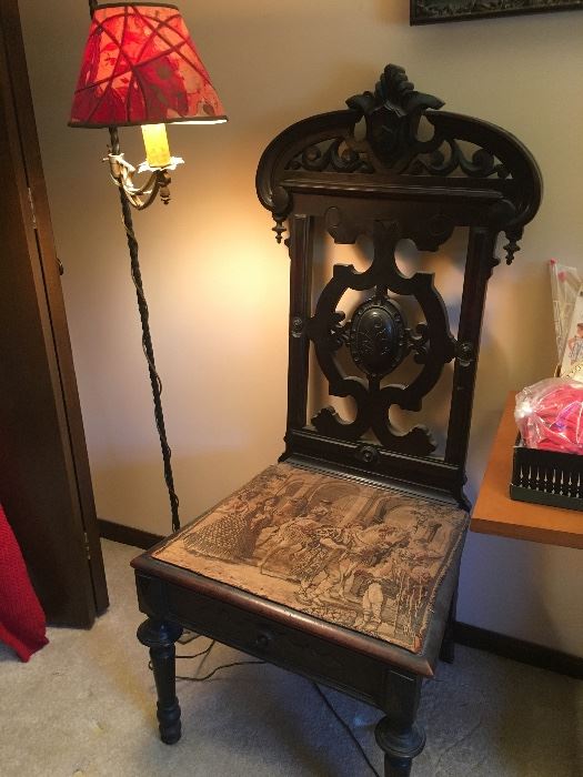 Antique Vintage hand carved wooden chair with tapestry. Seat lifts for storage compartment.