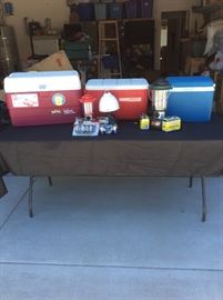 3 camp coolers and 3 camping lamps