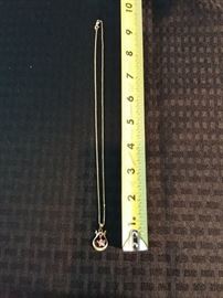 Gold pendant with angel and heart