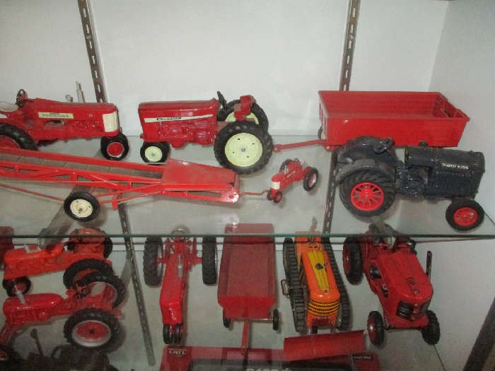 Toy tractors and farm implements