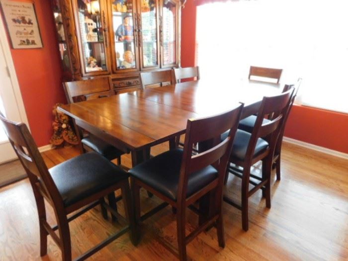 Solid Oak Dining table and 8 chairs.  8 Foot x 38" when leaves are extended and 6 foot without leaves 