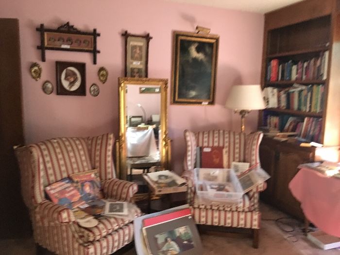 Antique wing chairs, pier mirror, antique oil painting, books, framed and I framed prints 