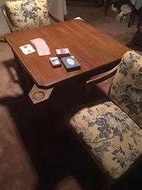 Antique oak game table with 4 chairs. 
