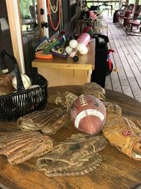 Variety of leather baseball gloves (some over 50 years old) and misc outdoor toys.